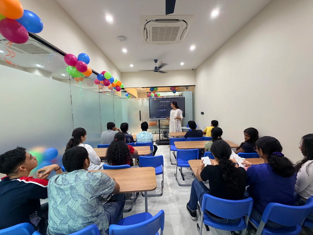Catalyst Classes teacher conducting a chemistry class on a digital board with students in a classroom, Hyderabad