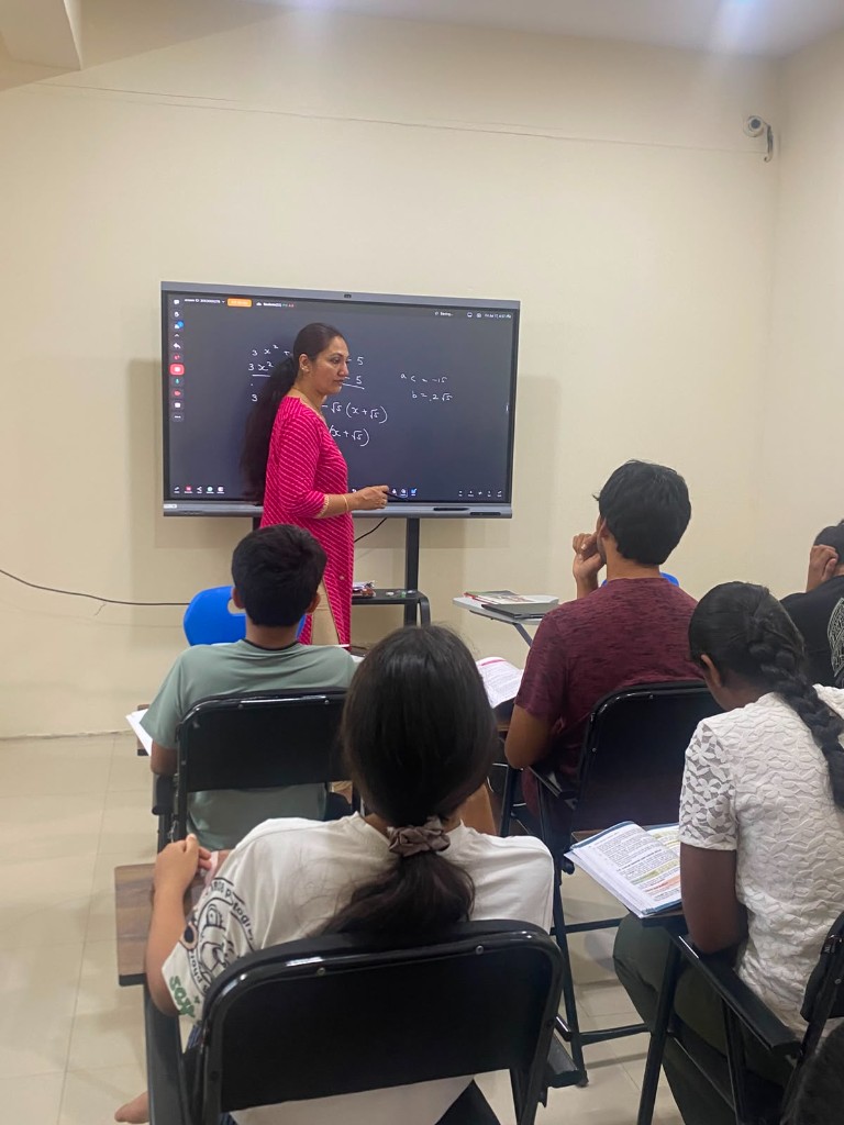 Catalyst Classes faculty teaching mathematics on a digital board to students in a classroom, Hyderabad