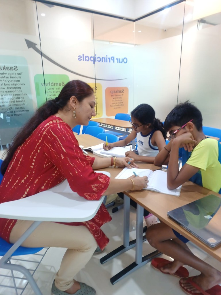 Teacher guiding students in a focused learning session at Catalyst Classes, Hyderabad
