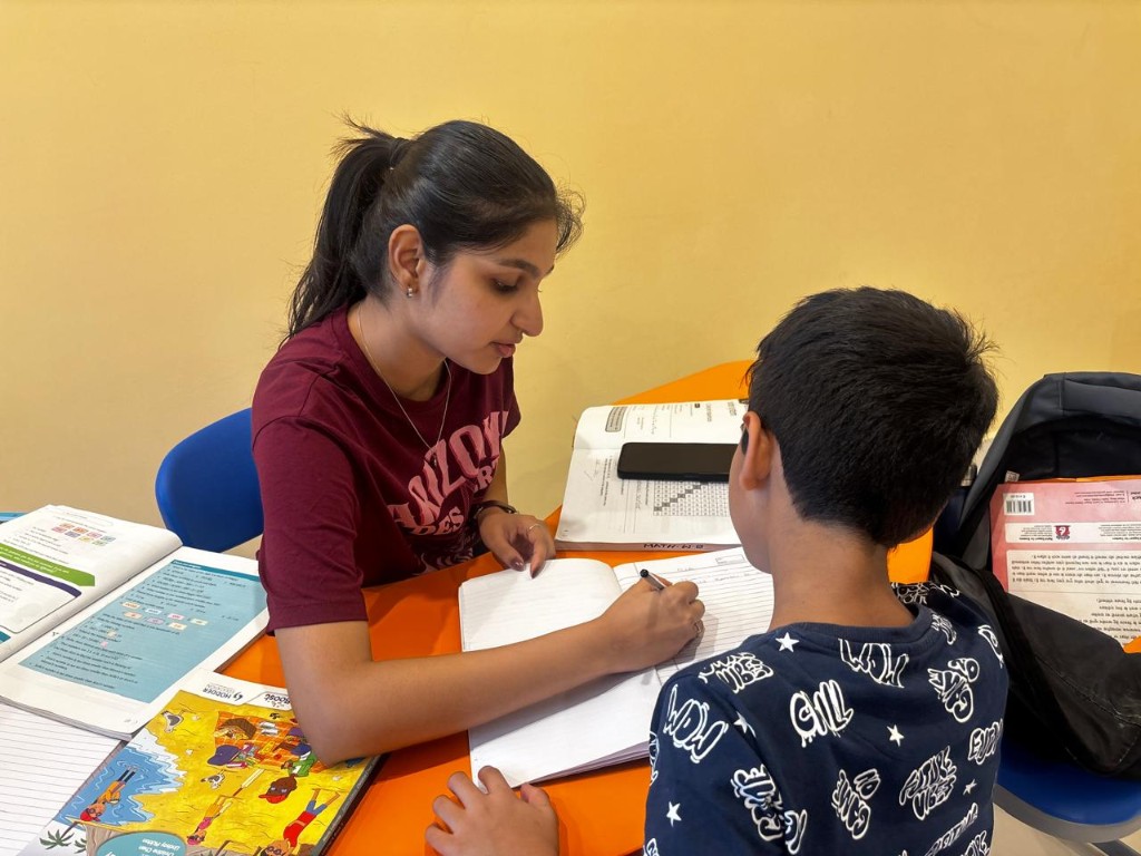 Students learning through guided practice with faculty at Catalyst Classes