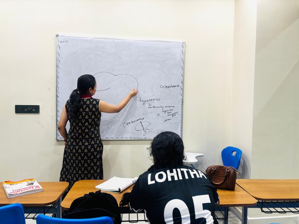 Teacher explaining concepts on whiteboard at Catalyst Classes, Hyderabad